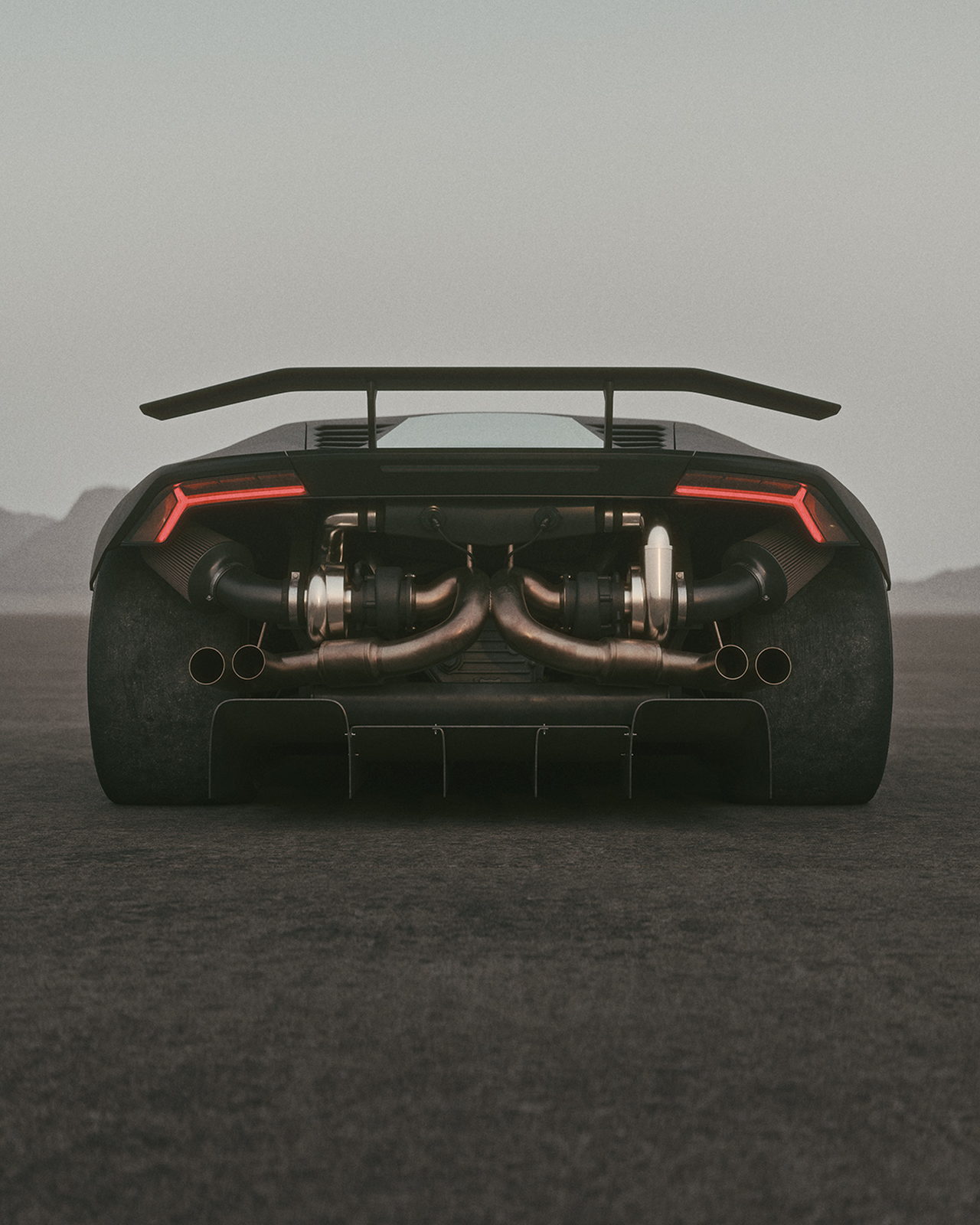 A supercar seen dead-on from behind, twin turbochargers and exhaust exposed.